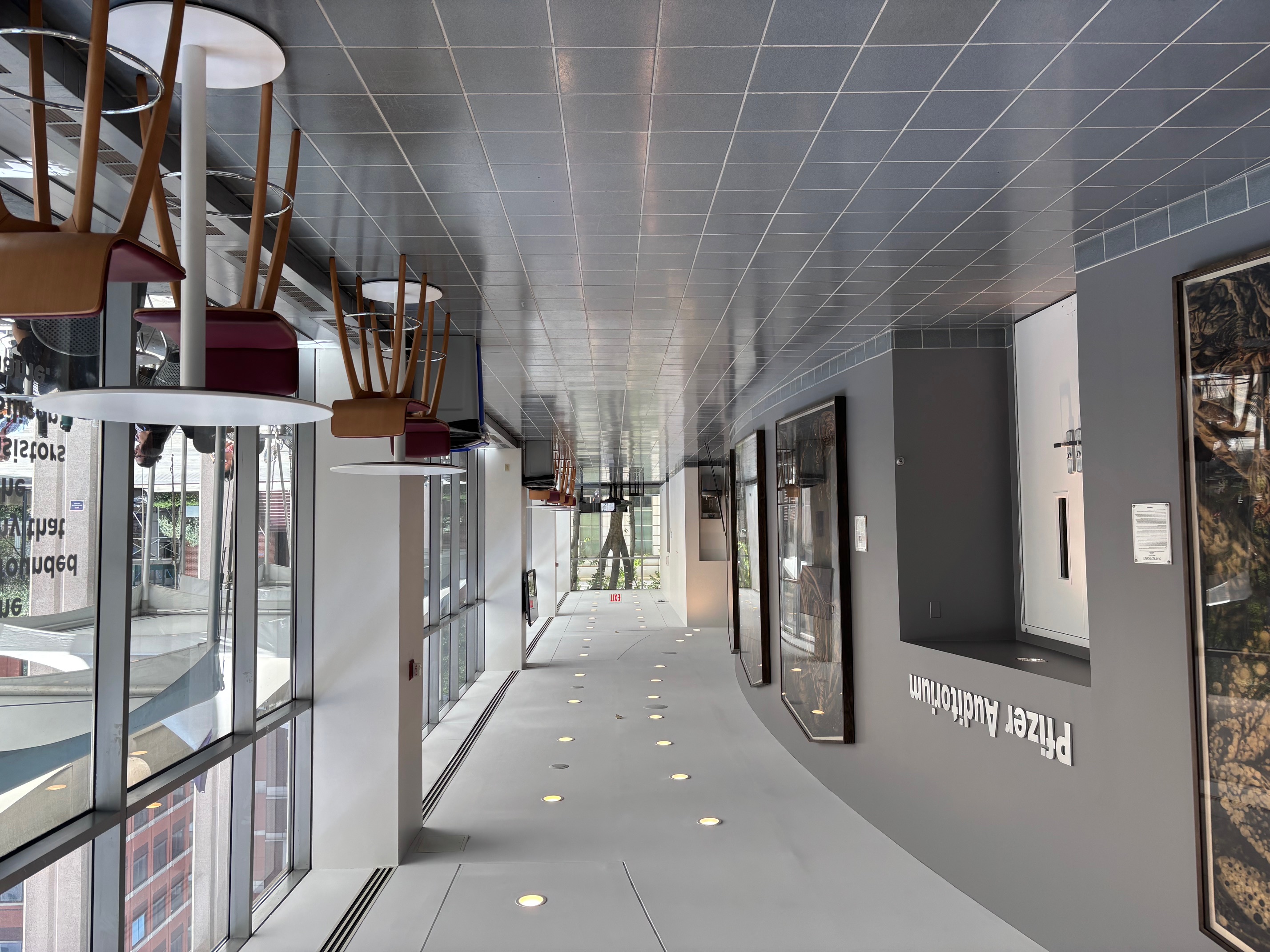 Open hallway with high top tables and chairs