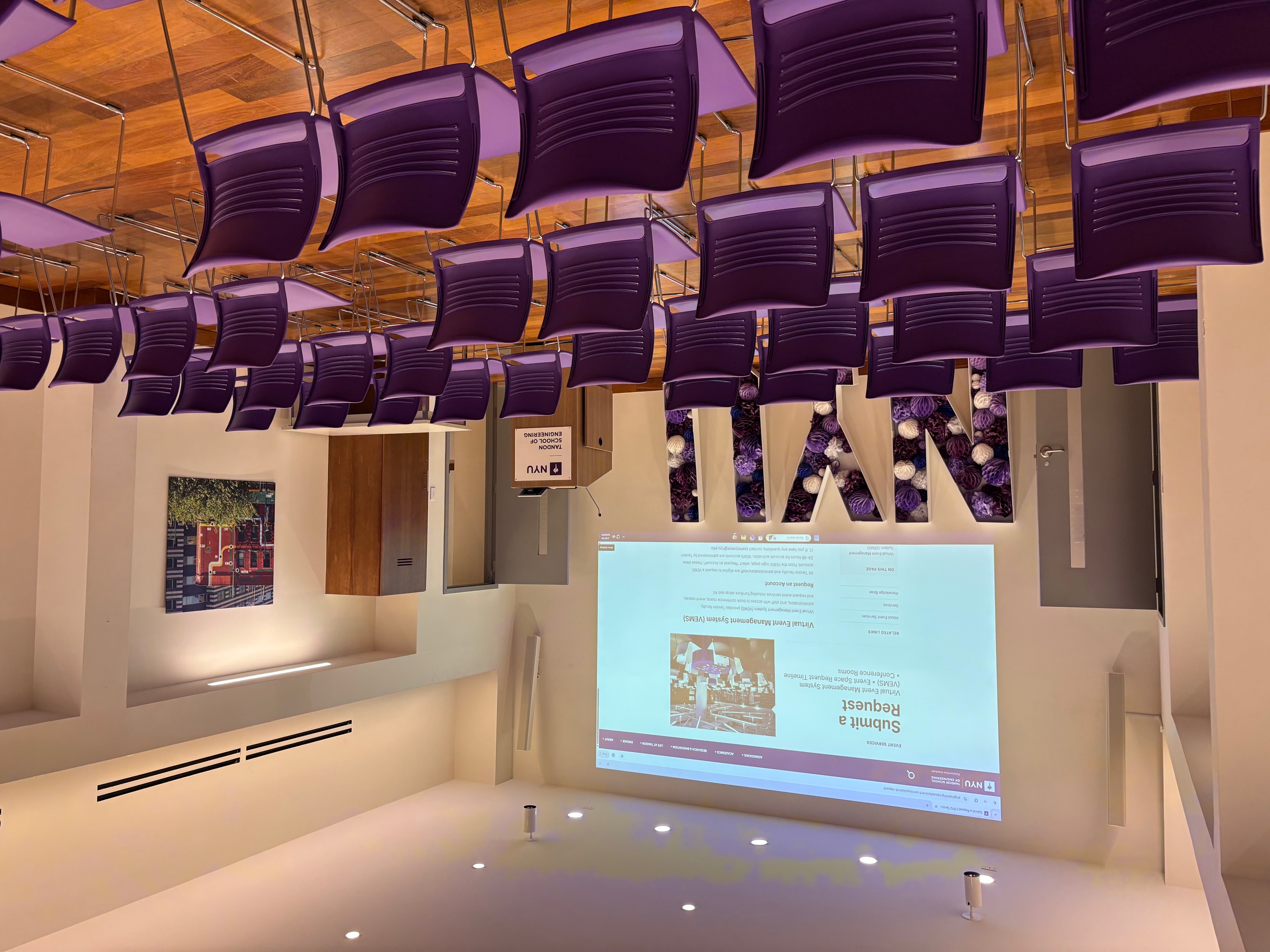 Room with rows of chairs and projection